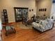 Comfortable living room featuring hardwood floors and cozy furnishings at 11033 Baywind Ct, Weeki Wachee, FL 34613