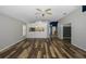 Spacious living room with dark hardwood floors and a ceiling fan at 1633 Arbor Knoll Loop, Trinity, FL 34655