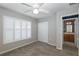 Bright bedroom with window shutters, double-door closet, and en-suite bathroom at 1633 Arbor Knoll Loop, Trinity, FL 34655