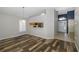 Dining area with wood-look floors and kitchen pass-through at 1633 Arbor Knoll Loop, Trinity, FL 34655