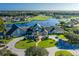 Aerial view of community, golf course, and lake at 1633 Arbor Knoll Loop, Trinity, FL 34655