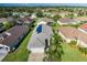 Aerial view of house with solar panels on roof at 1633 Arbor Knoll Loop, Trinity, FL 34655