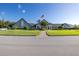 Community clubhouse exterior with landscaping and flag at 1633 Arbor Knoll Loop, Trinity, FL 34655