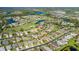 Aerial view of large community with houses, golf course, and lakes at 1633 Arbor Knoll Loop, Trinity, FL 34655
