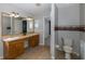 Bathroom with double vanity, tiled floor and toilet at 1633 Arbor Knoll Loop, Trinity, FL 34655