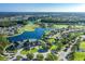 Aerial view of community, golf course, and lake at 1633 Arbor Knoll Loop, Trinity, FL 34655