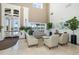 Spacious clubhouse lobby with seating and large windows at 1633 Arbor Knoll Loop, Trinity, FL 34655