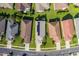 Aerial view of houses with solar panels and lush green lawns at 1633 Arbor Knoll Loop, Trinity, FL 34655