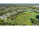 Community view with golf course and lake at 1633 Arbor Knoll Loop, Trinity, FL 34655