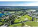 Aerial view of community golf course and lake at 1633 Arbor Knoll Loop, Trinity, FL 34655