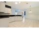 Kitchen features a breakfast nook and views into the living room at 12200 Putter Green Ct, New Port Richey, FL 34654