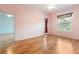 Light and airy bedroom with wood-look floors and sliding glass doors at 12200 Putter Green Ct, New Port Richey, FL 34654