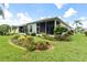 Landscaped backyard with manicured lawn and garden at 12200 Putter Green Ct, New Port Richey, FL 34654