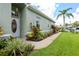 House exterior showcasing a walkway, landscaping, and front door at 12200 Putter Green Ct, New Port Richey, FL 34654