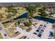 Aerial view of clubhouse and parking lot at 12200 Putter Green Ct, New Port Richey, FL 34654