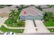 Aerial view of a two-story house with a two-car garage at 12200 Putter Green Ct, New Port Richey, FL 34654