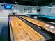 Community game room with shuffleboard tables at 12200 Putter Green Ct, New Port Richey, FL 34654