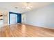 Living room with wood floors, high ceilings, and neutral color palette at 12200 Putter Green Ct, New Port Richey, FL 34654