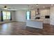 Bright kitchen features stainless steel appliances, a large island, and pendant lighting above the island at 19492 Fort King Run, Brooksville, FL 34601