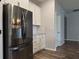 A kitchen with stainless steel refrigerator, white cabinets and drawers, and subway tile backsplash at 19492 Fort King Run, Brooksville, FL 34601