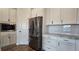 A kitchen featuring stainless steel appliances, white cabinets and drawers, and subway tile backsplash at 19492 Fort King Run, Brooksville, FL 34601
