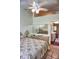 Bedroom with angled ceiling, fan, adjacent to the kitchen, complemented by tile floors at 20861 Haulover Cv # C4, Lutz, FL 33558