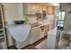 Well-lit kitchen with functional layout and white appliances at 20861 Haulover Cv # C4, Lutz, FL 33558