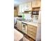 Bright kitchen featuring clean cabinets and appliances at 20861 Haulover Cv # C4, Lutz, FL 33558