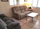 Living room featuring tile floors, cozy seating and natural light at 20861 Haulover Cv # C4, Lutz, FL 33558