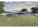 Lush backyard showcasing an above-ground pool at 3960 Lema Dr, Spring Hill, FL 34609