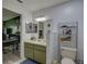 Dual-sink bathroom with good lighting, stylish decor, and efficient storage options at 3960 Lema Dr, Spring Hill, FL 34609