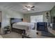 Comfortable bedroom featuring a ceiling fan, natural light, and a functional layout at 3960 Lema Dr, Spring Hill, FL 34609