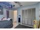 Cozy bedroom with grey walls, closet, and unique decor, creating a personalized space at 3960 Lema Dr, Spring Hill, FL 34609