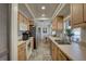 Functional kitchen features wood cabinets, modern appliances, and ample counter space at 3960 Lema Dr, Spring Hill, FL 34609