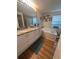 Bathroom featuring a double vanity with granite countertops and a soaking tub at 800 61St N St, St Petersburg, FL 33710