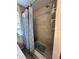 Bathroom featuring a tiled shower with neutral tones and decorative blue shower curtain at 800 61St N St, St Petersburg, FL 33710