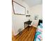 Bright bedroom featuring a twin bed and a desk area, with a whiteboard and hardwood floors at 800 61St N St, St Petersburg, FL 33710