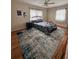 Bedroom with hardwood floors, neutral paint, ceiling fan, and a comfortable bed with nightstand at 800 61St N St, St Petersburg, FL 33710