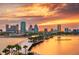 Dramatic sunset over the city skyline with waterfront views, palm trees, and modern architecture at 800 61St N St, St Petersburg, FL 33710
