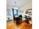 Bright dining area with wood floors, stylish lighting, and curated coffee bar detail at 800 61St N St, St Petersburg, FL 33710