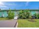 Home exterior showcasing lush tropical landscaping at 800 61St N St, St Petersburg, FL 33710