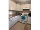 Bright kitchen features white cabinets and granite countertops at 800 61St N St, St Petersburg, FL 33710