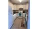 Clean kitchen with white cabinets, granite counters, and modern appliances at 800 61St N St, St Petersburg, FL 33710