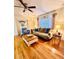 Relaxing living room with ceiling fan, hardwood floors and charming decor at 800 61St N St, St Petersburg, FL 33710