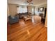 Bright living room with hardwood floors, ceiling fan, and cozy furniture at 800 61St N St, St Petersburg, FL 33710