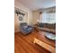 Cozy living room showcasing a comfortable chair, couch and hardwood floors at 800 61St N St, St Petersburg, FL 33710