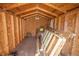 Interior of a wooden shed featuring exposed beams, plywood walls, and ample storage space at 800 61St N St, St Petersburg, FL 33710