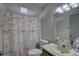 Bathroom with nautical-themed shower curtain at 3960 Lema Dr, Spring Hill, FL 34609
