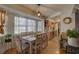 Spacious dining area with kitchen access, large windows and wood flooring at 3960 Lema Dr, Spring Hill, FL 34609