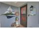 Front door entry with a charming nautical-themed decoration at 3960 Lema Dr, Spring Hill, FL 34609